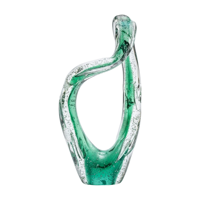 Green glass vase with a wavy design on a white background