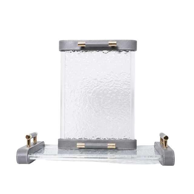 Decorative glass vase with gray metal base and accents on a white background